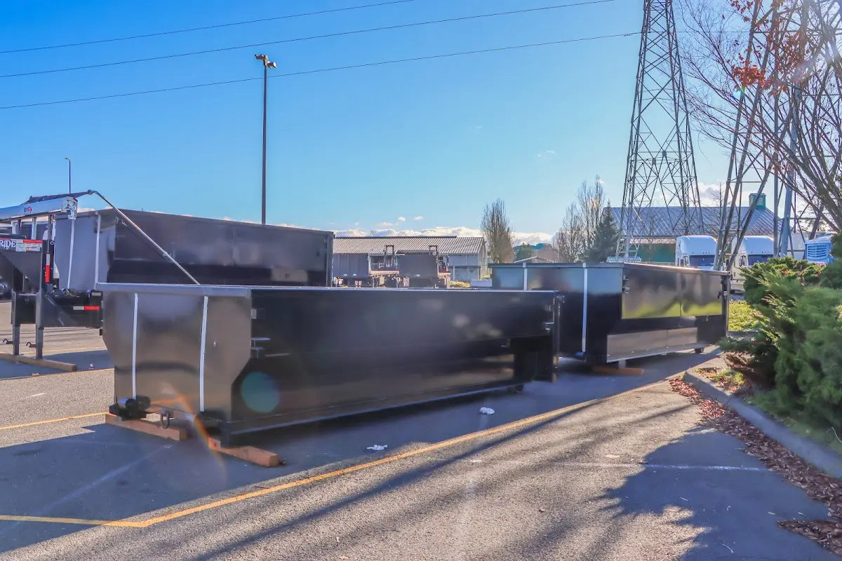 Roll-off dumpster ready for waste disposal at job site for Yard Waste Dumpster Rental in Somerville